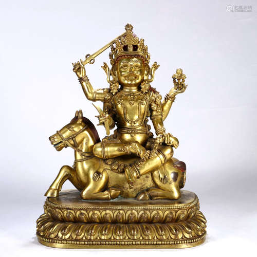 A Gilt Bronze Four-Armed Buddha Figurine