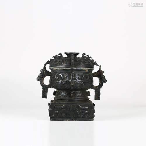 A Bronze Taotie Mask Cover Vessel