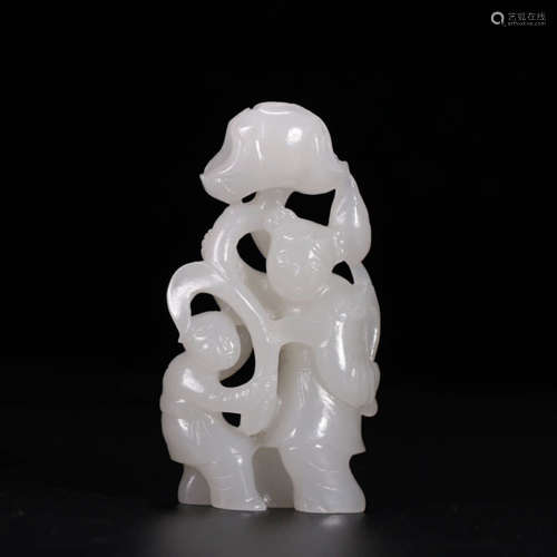 A White Jade Carved ‘Child-With-Lotus’ Ornament