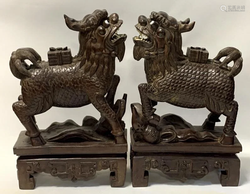 Two Carved Wood Beasts