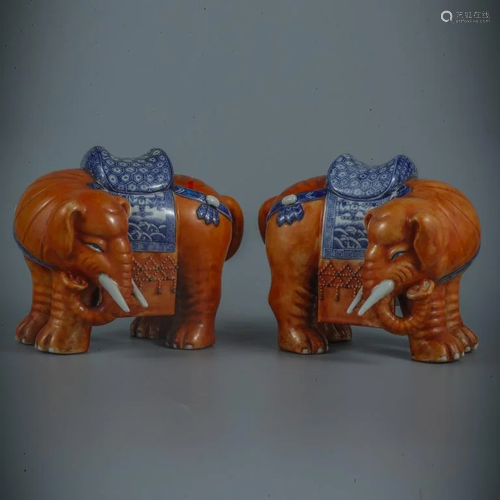 A Pair of Glazed Porcelain Elephants.