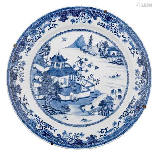 A Chinese blue and white decorated plate, the cent…