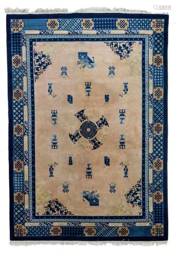 A Chinese woollen rug, decorated with antiquities,…