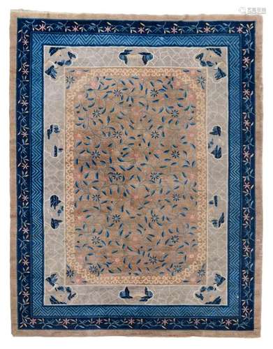 A Chinese rug decorated with stylized floral motif…