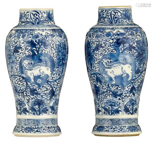 A pair of blue and white floral decorated vases, t…