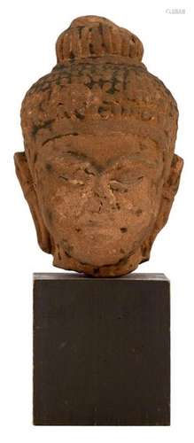 A Thai red sandstone Buddha head with traces of bl…