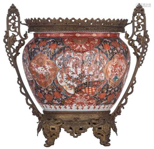 A Japanese floral decorated Imari jardinière with …