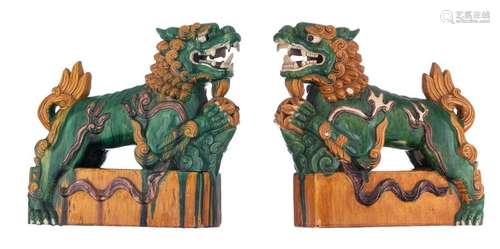 A pair of sancai glazed guardian Fu lions, H 45 W …