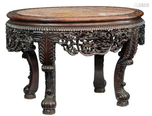 A Chinese richly carved exotic hardwood table with…