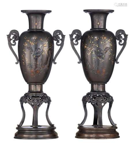 A pair of Japanese bronze vases, with relief decor…