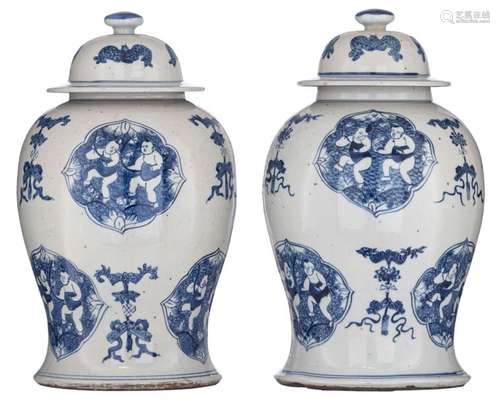 A pair of Chinese blue and white covered vases, th…