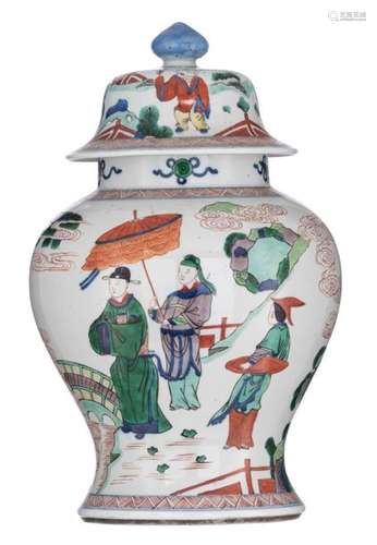 A Chinese wucai vase and cover, decorated with fig…