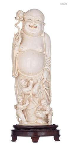 A Chinese Canton ivory statue depicting Budai acco…