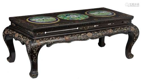 A Chinese black lacquered coffee table with floral…