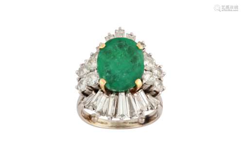 An emerald and diamond cluster ring