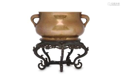 A CHINESE BRONZE INCENSE BURNER WITH A BRONZE STAND.