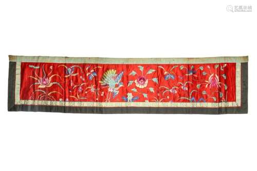 A CHINESE RED-GROUND EMBROIDERED 'PEACOCK' TEXTILE PANEL.