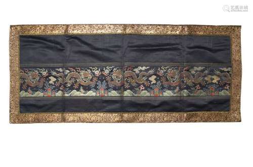 A CHINESE IMPERIAL BLUE-GROUND SILK 'DRAGON' PANEL. Qing Dynasty, 18th Century. The horizontal