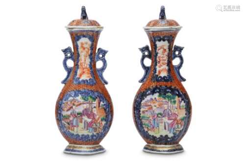 A PAIR OF CHINESE MANDARIN PALLET VASES AND COVERS.
