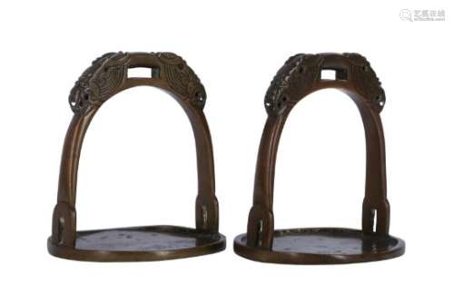 A PAIR OF CHINESE BRONZE STIRRUPS.