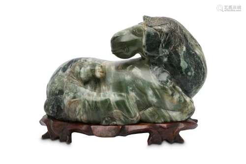 A CHINESE GREEN JADE HORSE GROUP.