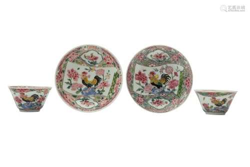 A NEAR-PAIR OF CHINESE FAMILLE ROSE 'COCKERELS' CUPS AND SAUCERS.