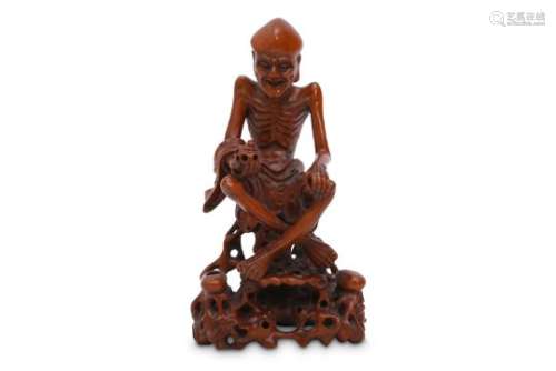 A CHINESE BOXWOOD FIGURE OF A LUOHAN.