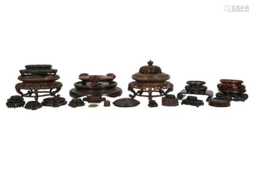 TWENTY-SEVEN CHINESE WOOD STANDS.