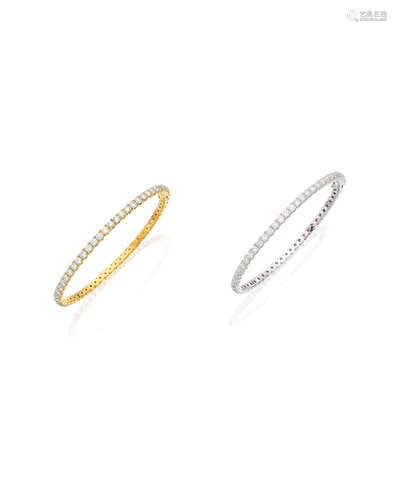 A PAIR OF DIAMOND BANGLES (2)