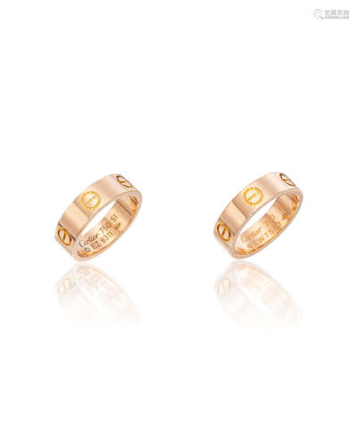 A PAIR OF 18K ROSE GOLD 'LOVE' RINGS, CARTIER (2)