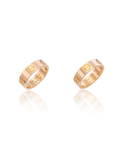 A PAIR OF 18K ROSE GOLD 'LOVE' RINGS, CARTIER (2)
