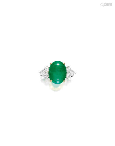 A CABOCHON EMERALD AND DIAMOND RING