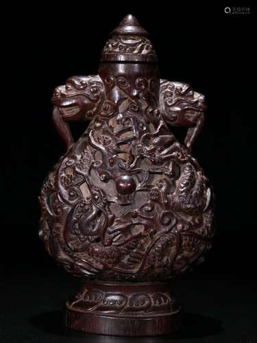 A Chinese Rosewood Snoof Bottle With Dragon Carving