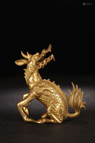 A Chinese Gilt Bronze Qilin Carved Paperweight Ornament