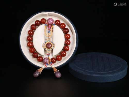A Chinese Amber 18-Bead Pendant