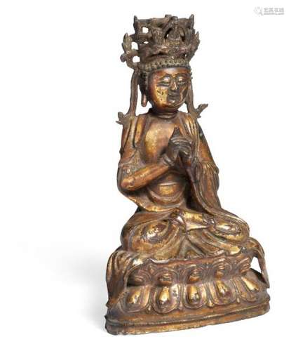 A Chinese small Guanyin of cold gilded bronze seated in Uttarabodhi mudra on a double [...]