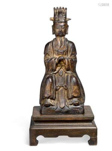 A Chinese partly gilded bronze official. Ming, 16th-17th century.  Weight 1150 g. H. [...]