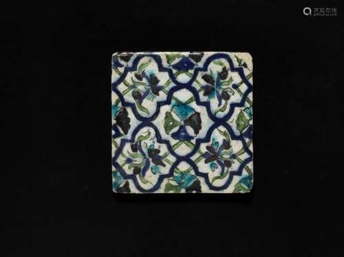 A Damascus pottery tile decorated in underglaze with flowers and stylized design in [...]