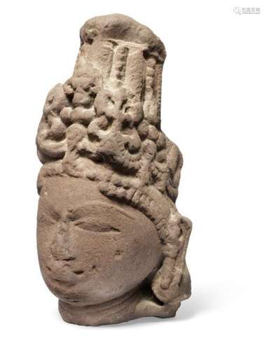 A buff sandstone fragment head possibly depicting Surya, with crown and heavy [...]