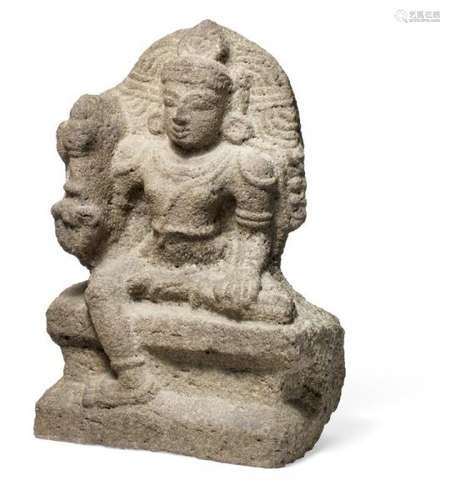 A volcanic stone figure of a bodhisattva seated on a throne with crowned head and [...]