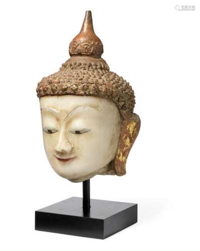 A Burmese alabaster Buddha's head. 18th-19th century. Raised onto a metal stand. H. [...]