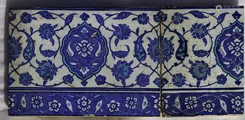 An Iznik pottery frieze tile and half a frieze tile. 19 x 26.5 and 19 x 14.5 cm. (2) -