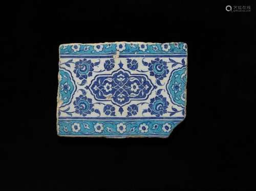 An Iznik pottery tile decorated in blue and turquoise on white ground with design and [...]