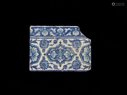 An Iznik pottery frieze tile decorated in blue and turquoise on white ground with [...]