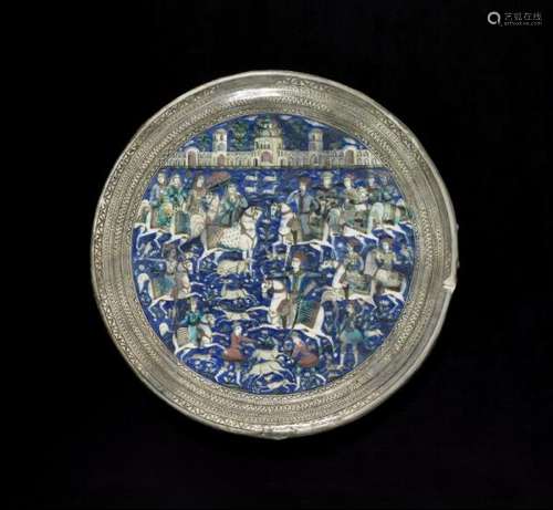 A large Qajar circular pottery tile. Iran, late 19th century. Diam. 56.5 cm. -