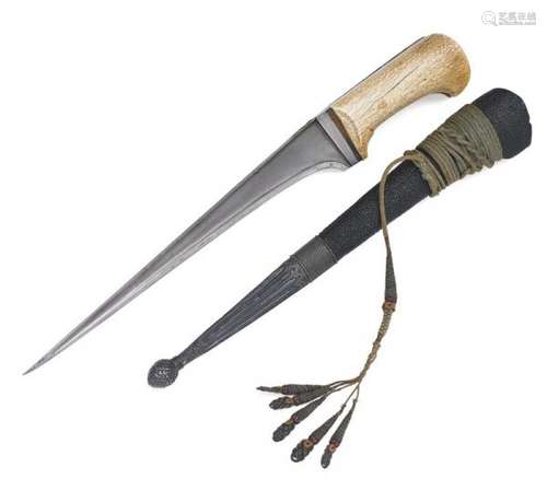 A large Persian Pesh Kabz dagger with a grip in walrus ivory. -