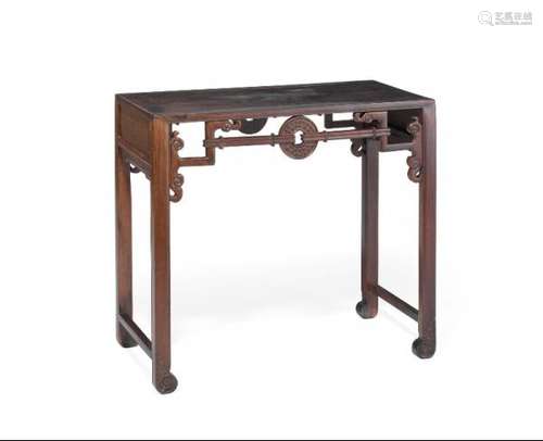 A Chinese hardwood table. Late Qing, early 20th century. H. 83 cm. W. 92 cm. D. 45 cm. -