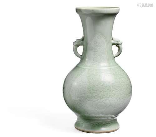 A Chinese celadon baluster vase with twin mask-and-tongue handles. Qing 18th-19th [...]