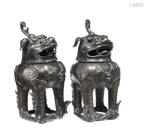 A pair of patinated bronze Chinese Luduan censers. Ming 1368-1644. H. 18 cm. (2) -