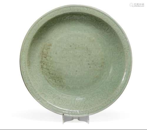 A massive Chinese Longquan ware celadon dish. Ming 1368-1644. Diam. 46 cm. -